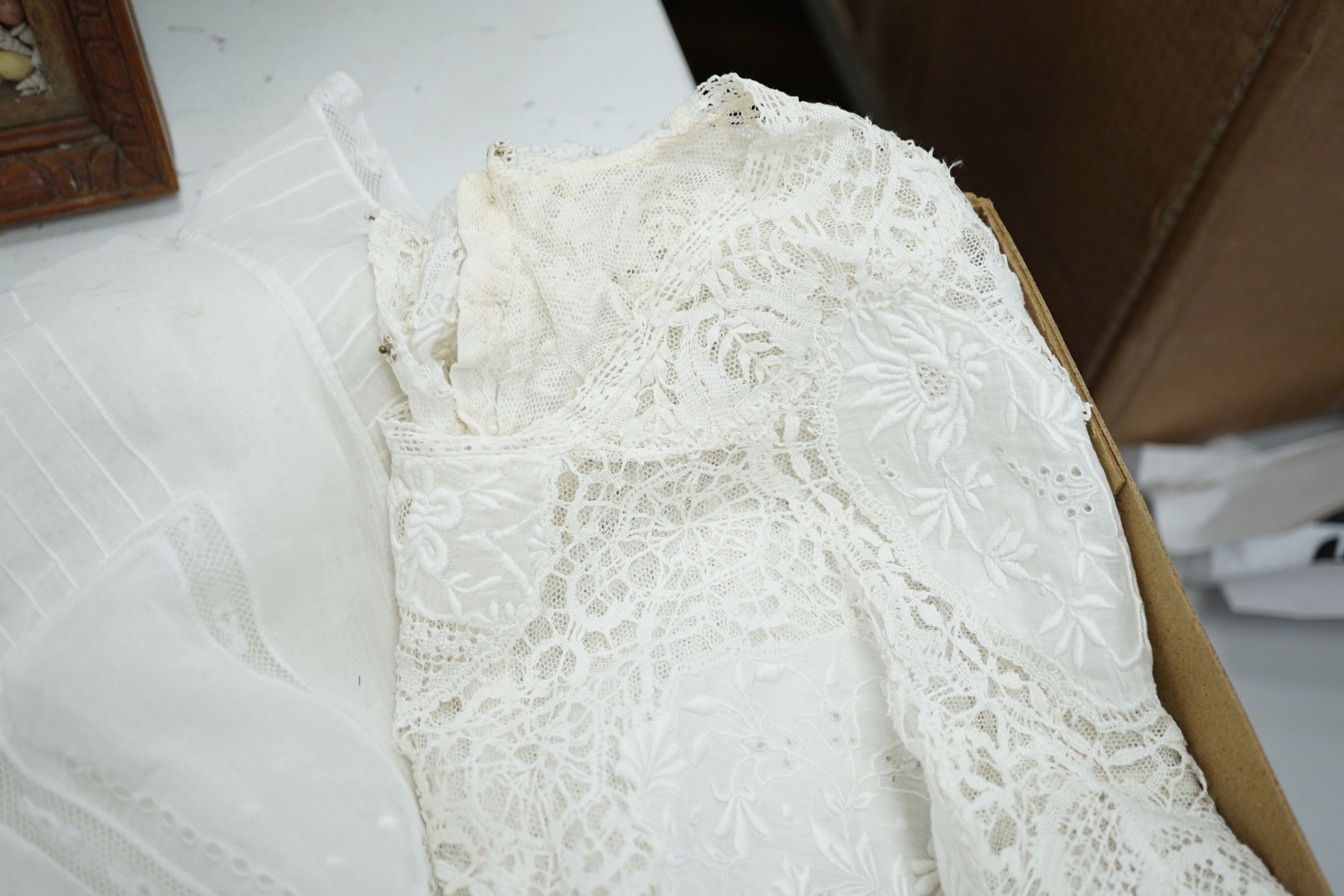 A 19th century hand made Irish crochet jacket, with long sleeves and high collar, a bobbin lace and white worked patch worked blouse, a fine lawn and anglaise worked blouse and a fine bobbin lace trimmed and white worked
